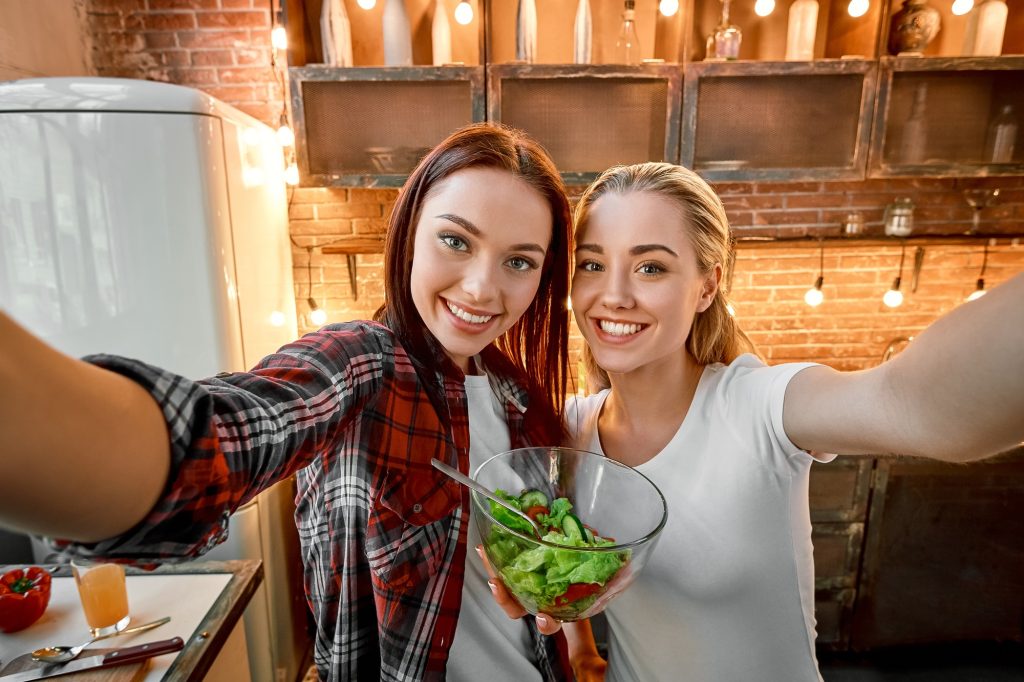 Food is always about cooking and eating with those you love and care for. Young female friends in